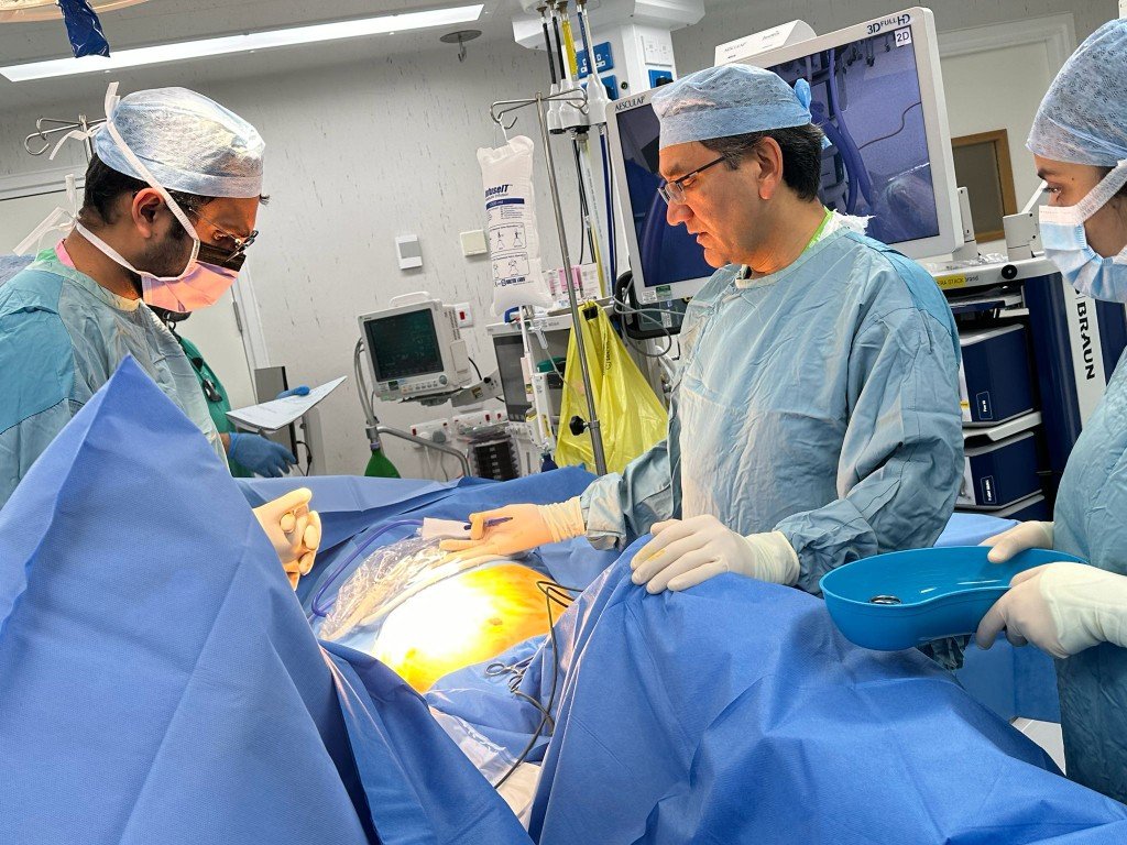Mr Mehmood performing laparoscopic surgery with surgical team